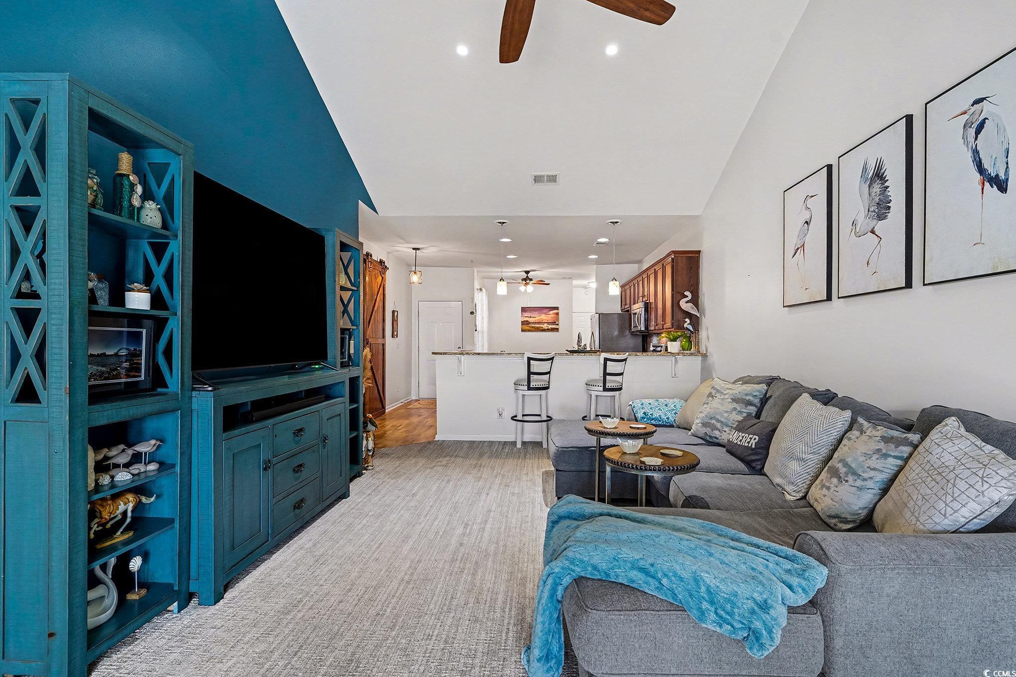 1526 Palmina Loop, Unit C Myrtle Beach, SC 29588 - Photo 10 of 34 Living room with a ceiling fan, lofted ceiling, and recessed lighting