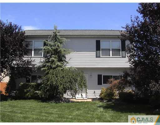 95 Winthrop Road Edison, NJ 08817 - Photo 1 of 25 a front view of a house with a yard