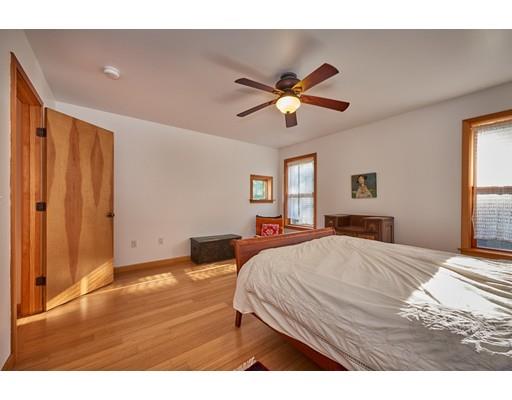 139 Brickyard Road Southampton, MA 01073 - Photo 21 of 29 a living room with a bed furniture and a window