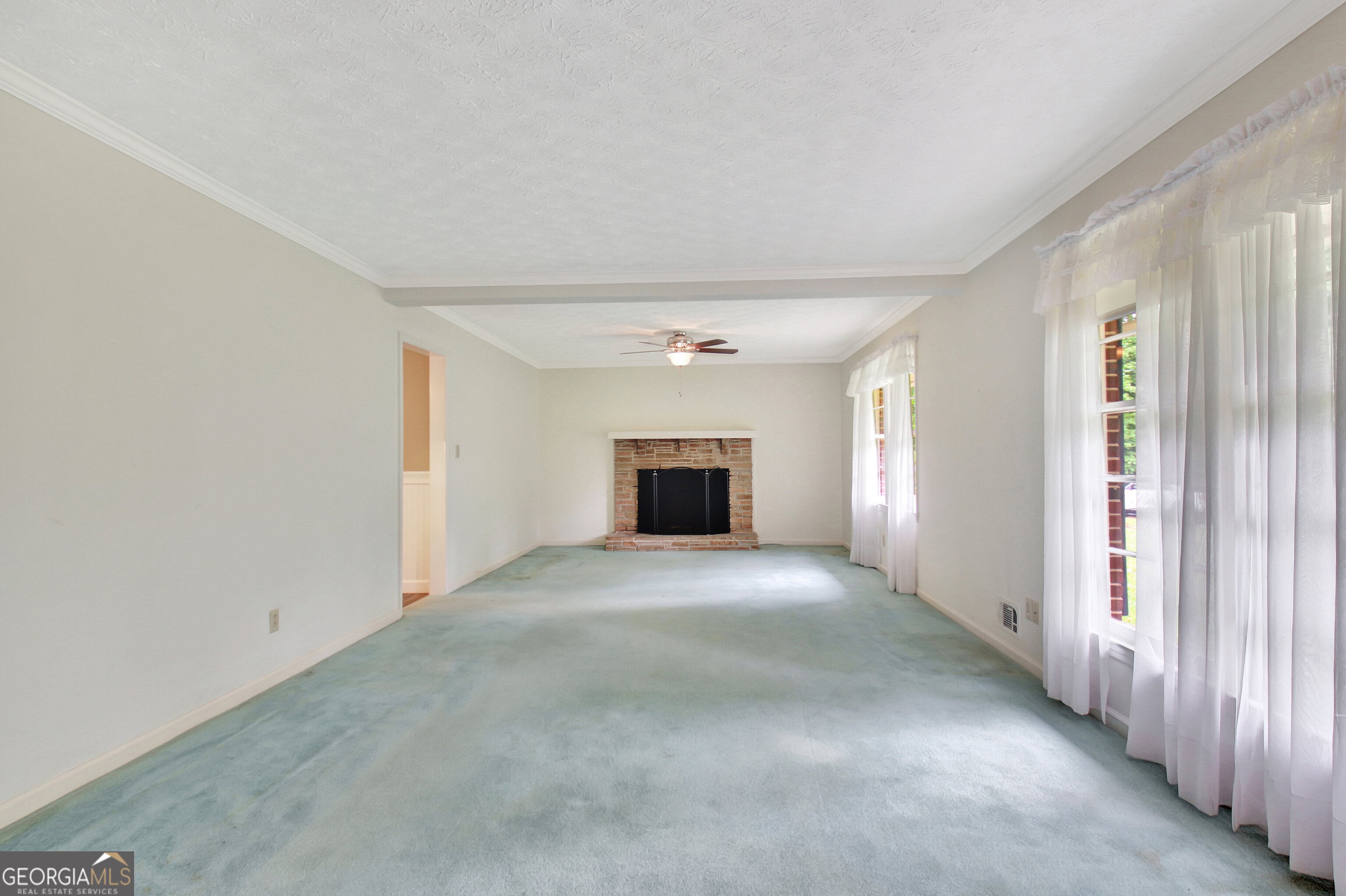 717 Tyrone Road Tyrone, GA 30290 - Photo 13 of 58 a view of empty room with wooden floor and window