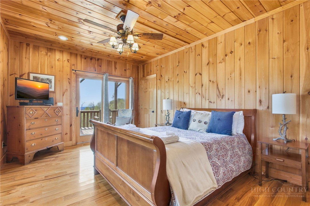 2081 Blackberry Road Boone, NC 28607 - Photo 39 of 45 a bedroom with a bed and wooden floor