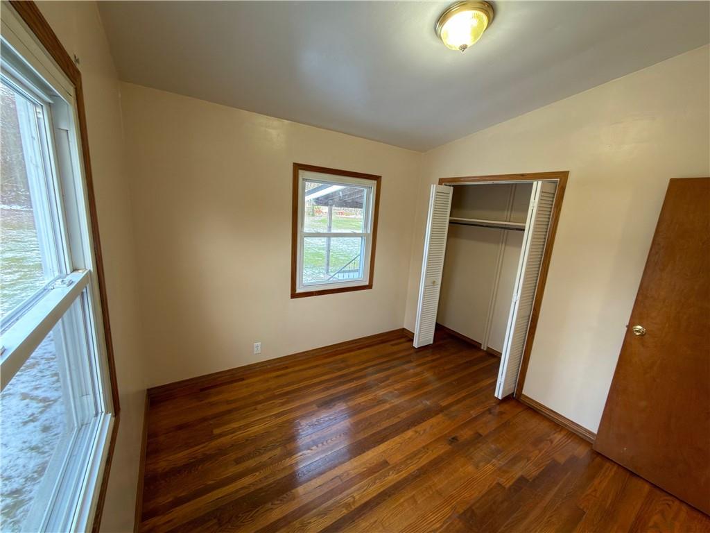 6964 Dermond Road Hermitage, PA 16148 - Photo 11 of 20 an empty room with wooden floor and windows