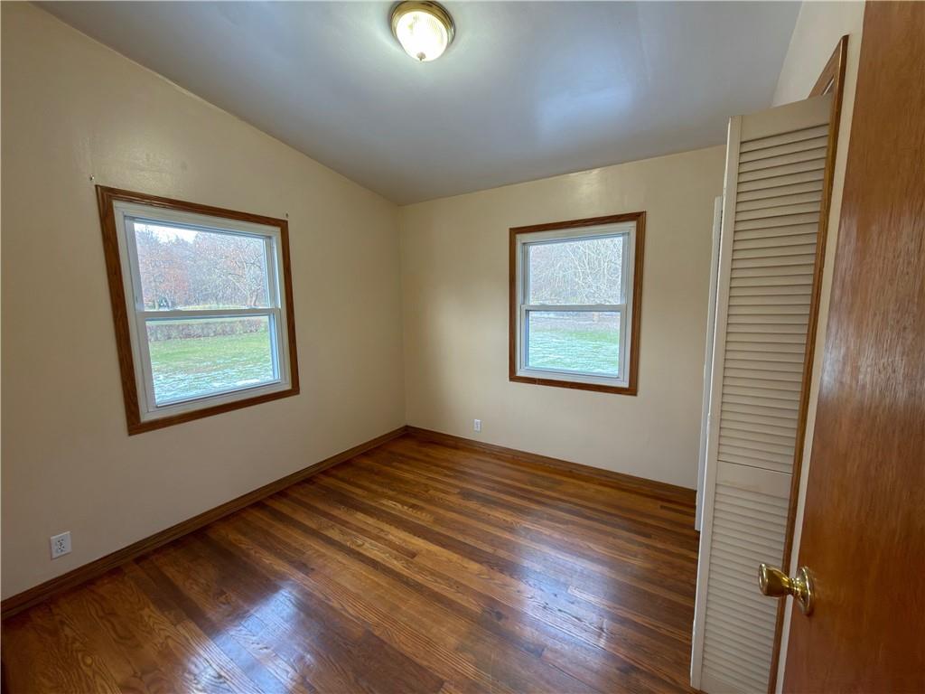 6964 Dermond Road Hermitage, PA 16148 - Photo 12 of 20 a view of an empty room with window and wooden floor