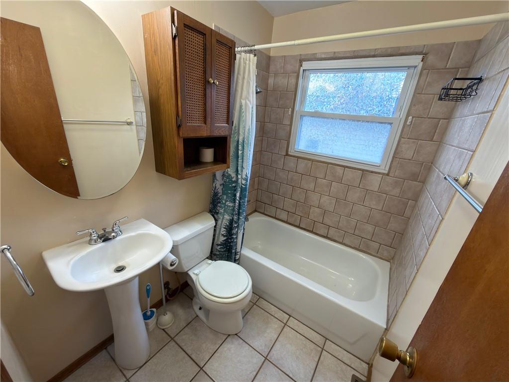 6964 Dermond Road Hermitage, PA 16148 - Photo 15 of 20 a bathroom with a sink toilet and shower