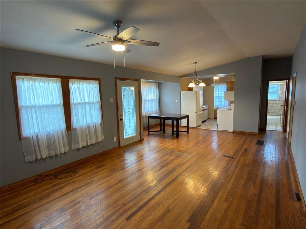 6964 Dermond Road Hermitage, PA 16148 - Photo 9 of 20 a view of an empty room with wooden floor and a window