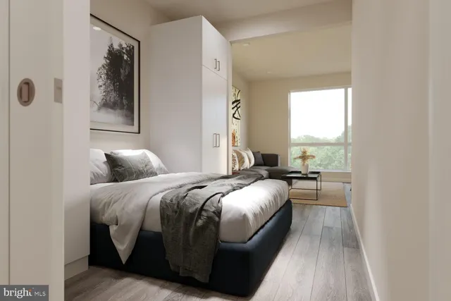 a bedroom with a bed and a window