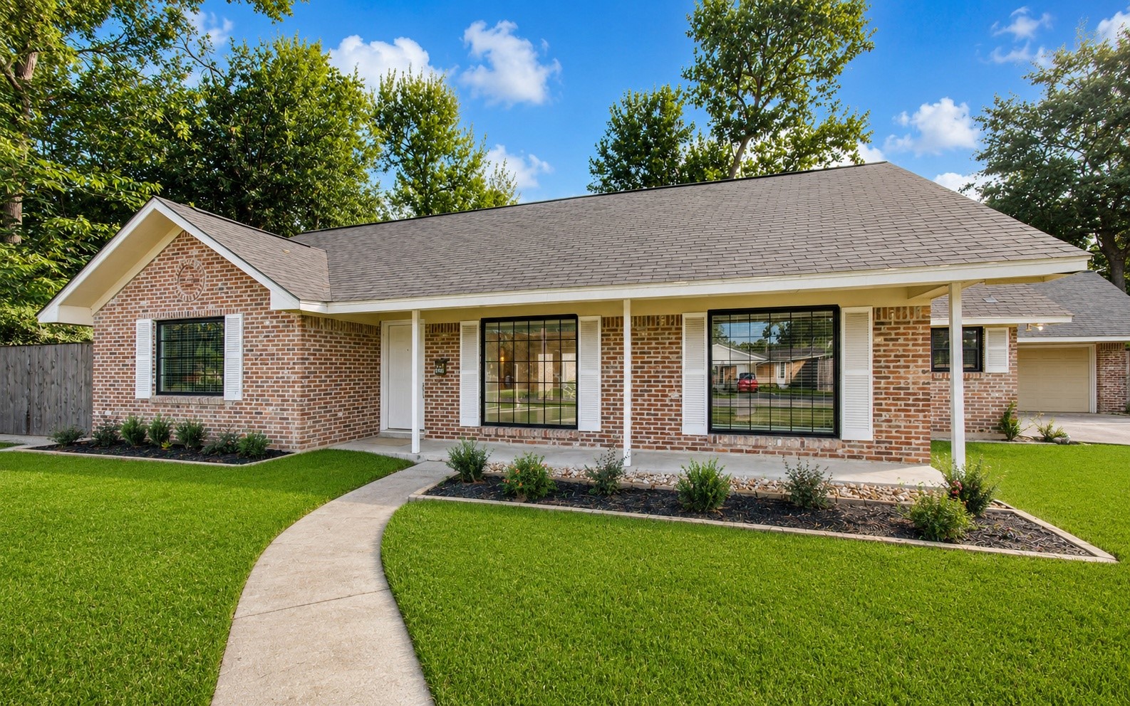 1801 Benbow Way Houston, TX 77080 - Photo 1 of 32 Charming single-story brick home with a spacious front lawn and a cozy porch. Large windows provide natural light, and the well-maintained landscaping adds to the curb appeal. Perfect for comfortable, suburban living.