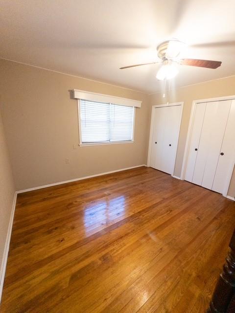 613 Laurel Road Athens, TX 75751 - Photo 12 of 13 Bedroom featuring wood-finish flooring, neutral wall color, and a ceiling fan with integrated lighting