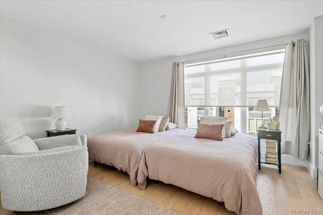 a bedroom with a bed and a couch