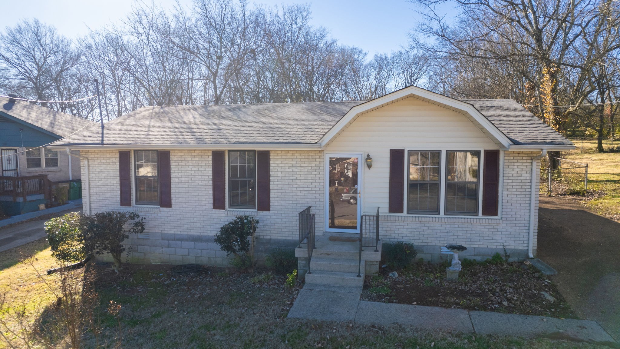 a front view of a house with garden