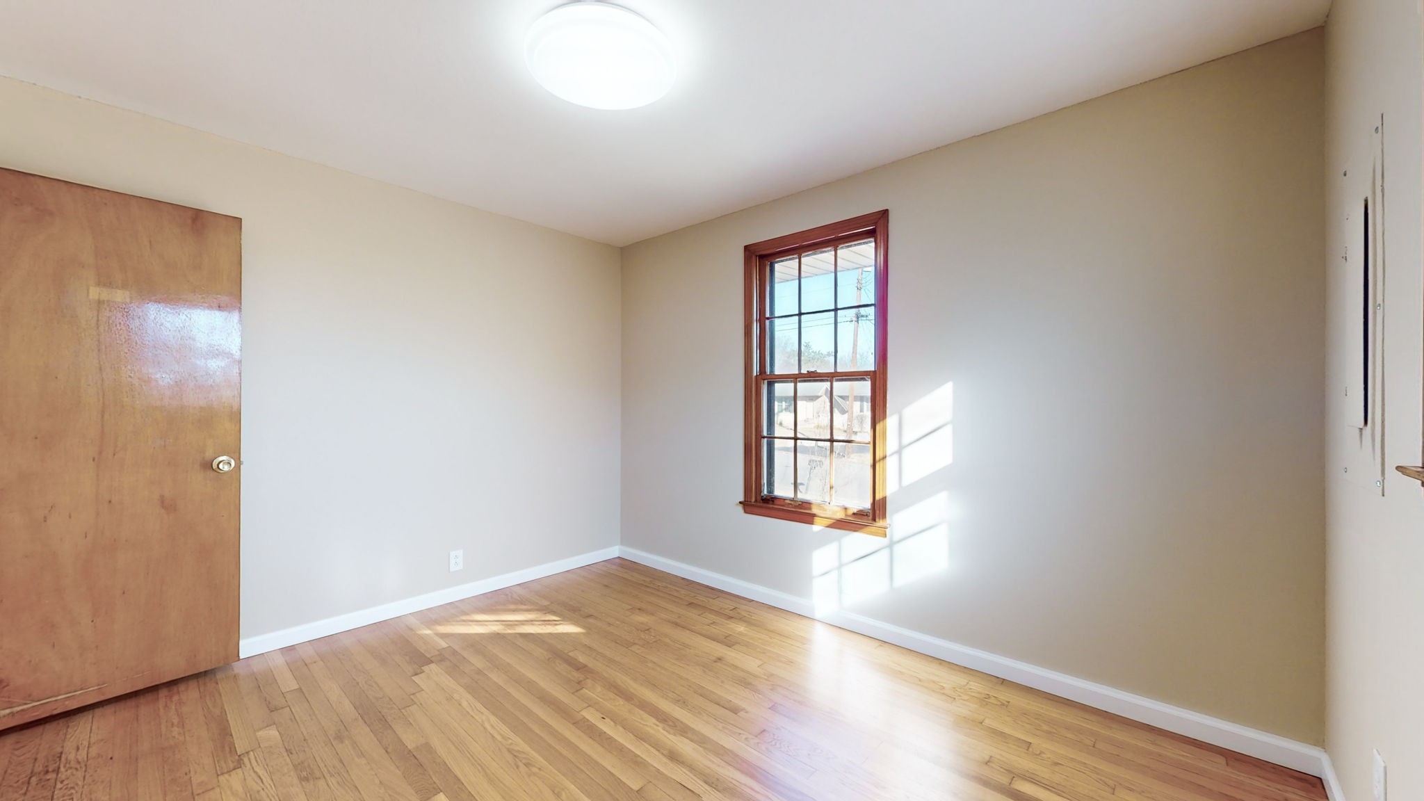 622 Mayview Drive Madison, TN 37115 - Photo 16 of 27 an empty room with wooden floor and windows