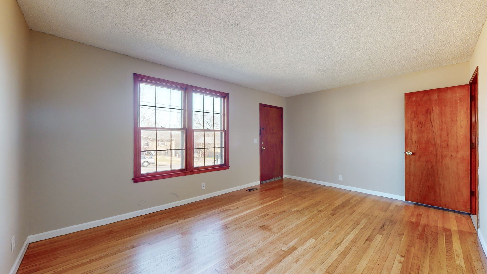 622 Mayview Drive Madison, TN 37115 - Photo 2 of 27 an empty room with wooden floor and windows