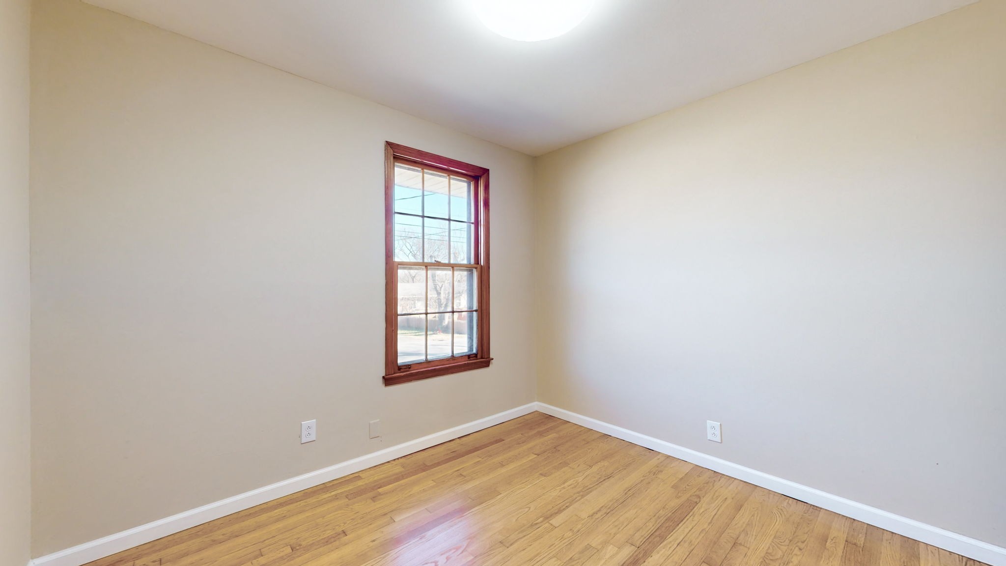 622 Mayview Drive Madison, TN 37115 - Photo 22 of 27 an empty room with wooden floor and windows