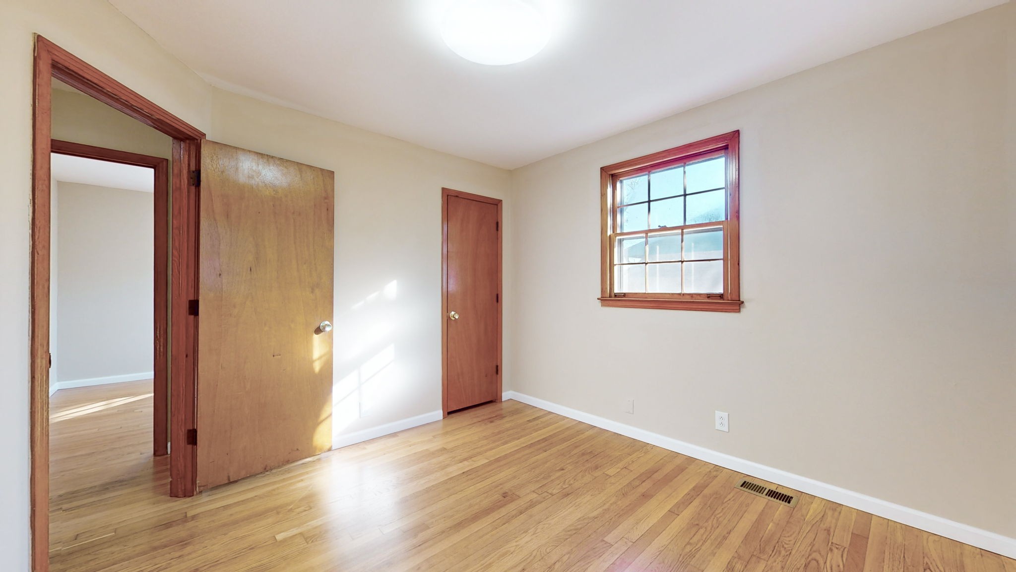 622 Mayview Drive Madison, TN 37115 - Photo 23 of 27 a view of an empty room with wooden floor and a window
