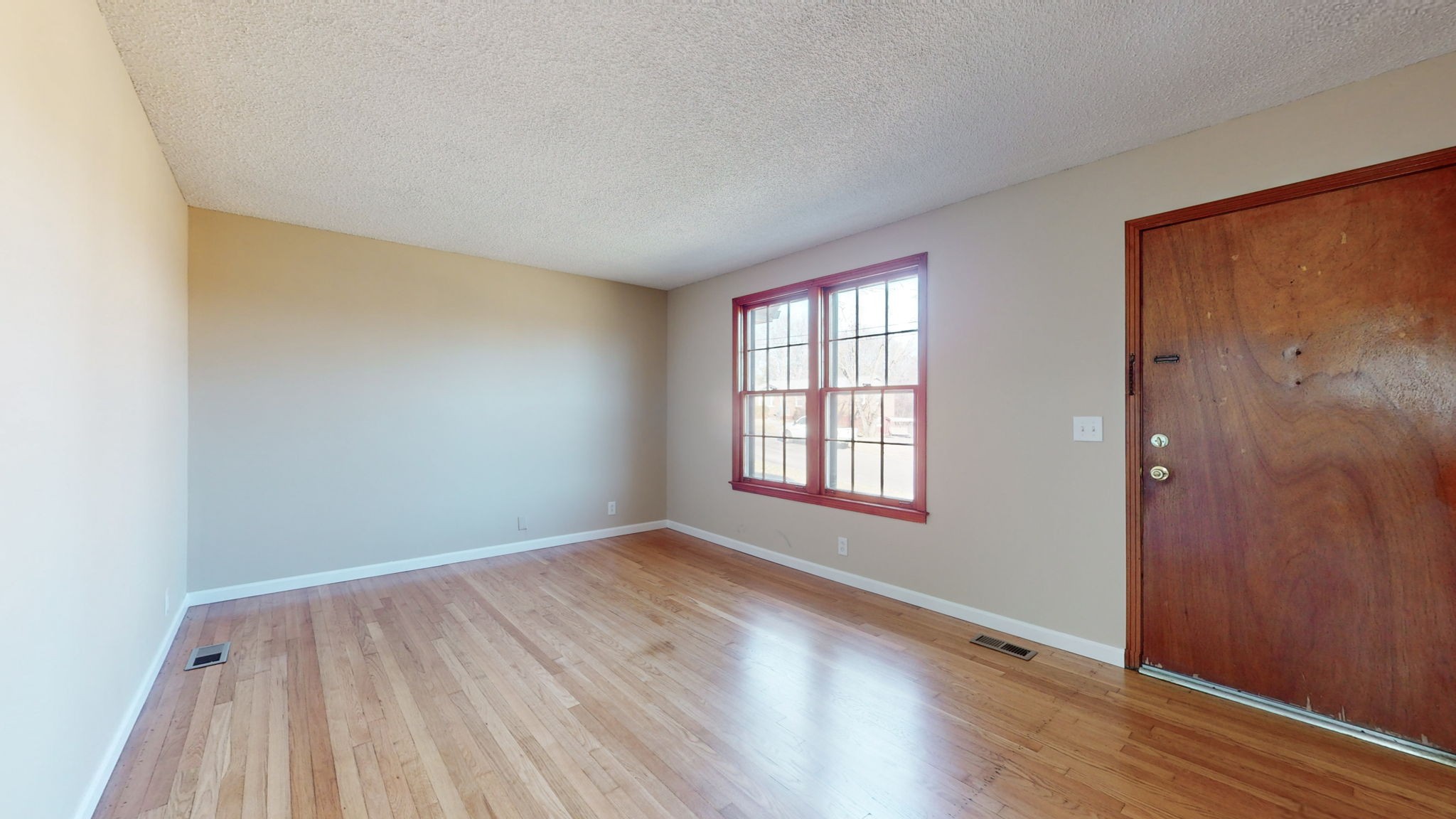 622 Mayview Drive Madison, TN 37115 - Photo 6 of 27 an empty room with wooden floor and windows