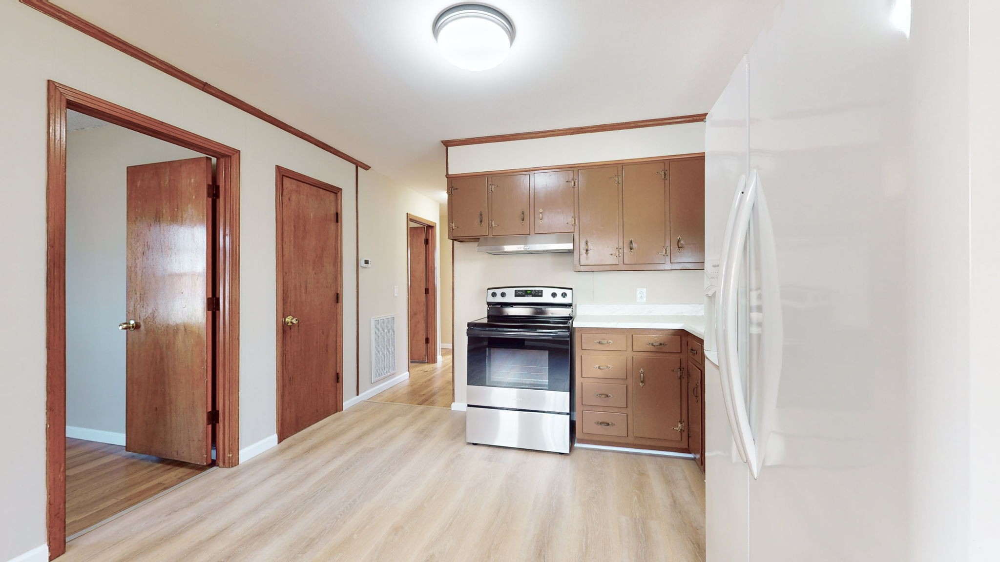 622 Mayview Drive Madison, TN 37115 - Photo 7 of 27 a kitchen with a refrigerator and a stove