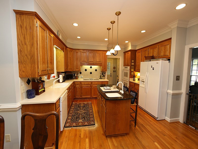 321 Jellison Court Raleigh, NC 27615 - Photo 8 of 24 Granite on the Island, Solid Surface on the rest of counters Kitchen
