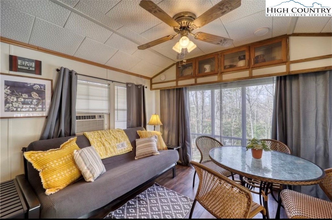 85 Jack Pine Loop Newland, NC 28657 - Photo 18 of 20 a living room with furniture and a large window