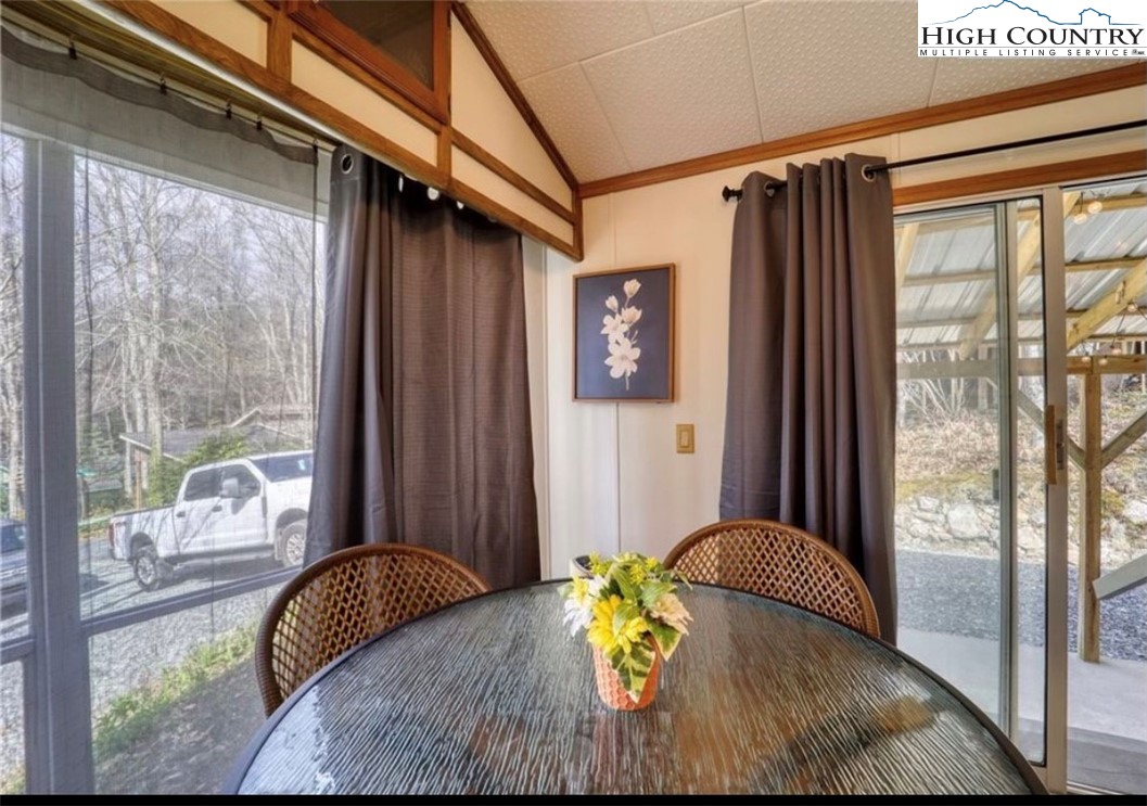 85 Jack Pine Loop Newland, NC 28657 - Photo 19 of 20 a view of a bedroom with furniture and a window