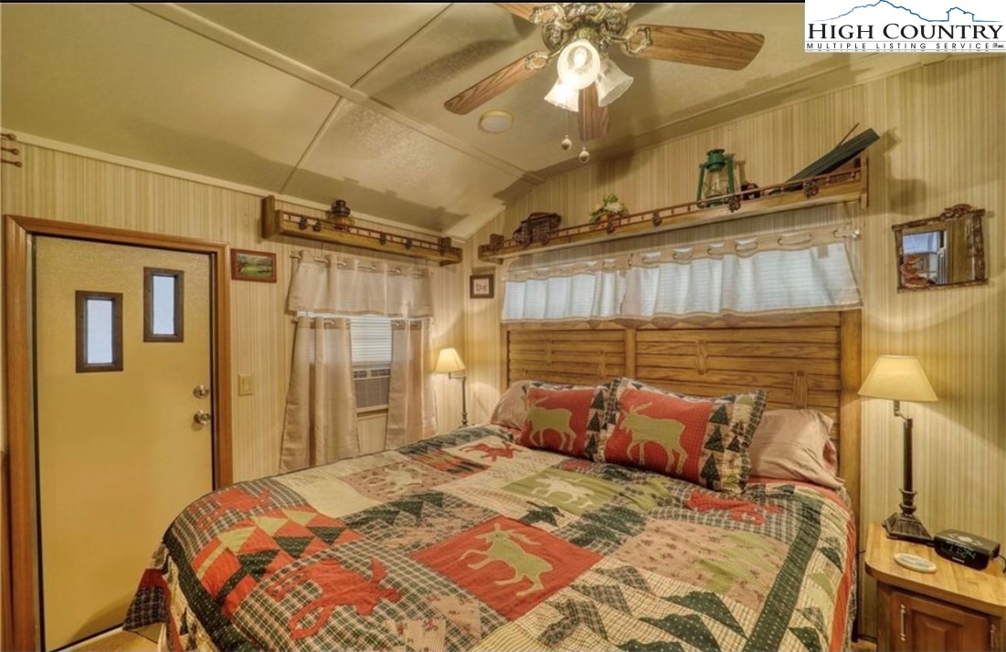 85 Jack Pine Loop Newland, NC 28657 - Photo 6 of 20 a bedroom with a bed and a table