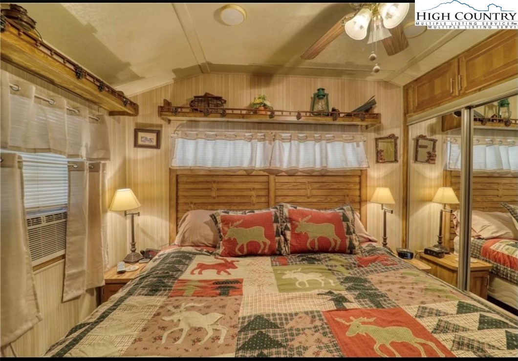 85 Jack Pine Loop Newland, NC 28657 - Photo 7 of 20 a bed room with a bed and a painting