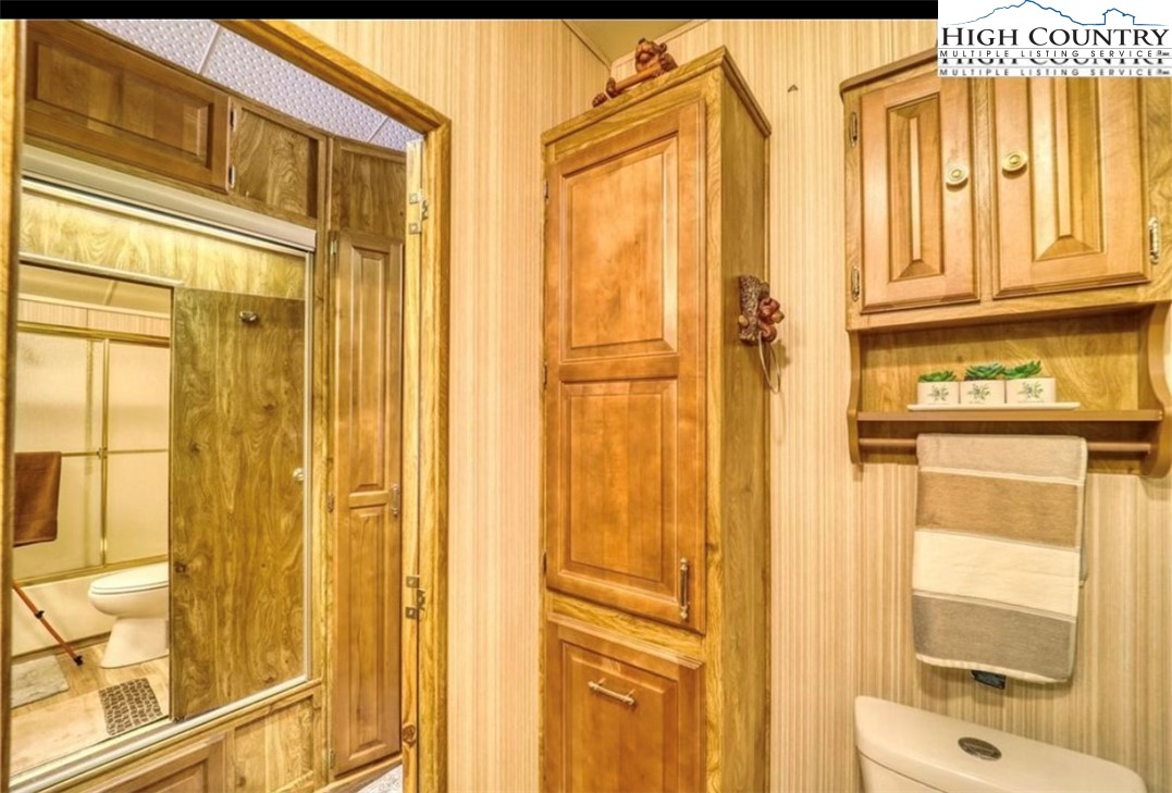 85 Jack Pine Loop Newland, NC 28657 - Photo 8 of 20 view of a bathroom with a shower and a door