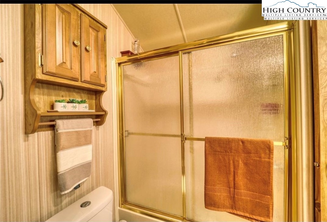 85 Jack Pine Loop Newland, NC 28657 - Photo 10 of 20 a bathroom with a shower and a sink