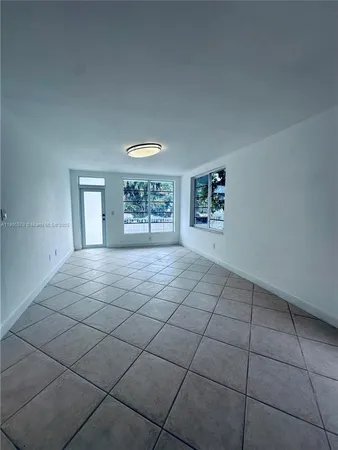 a view of an empty room and window