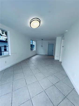 a view of a livingroom and wooden floor