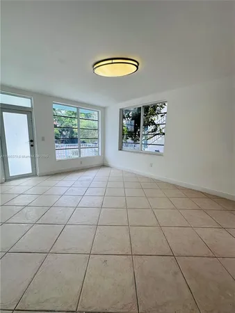 a view of an empty room and window