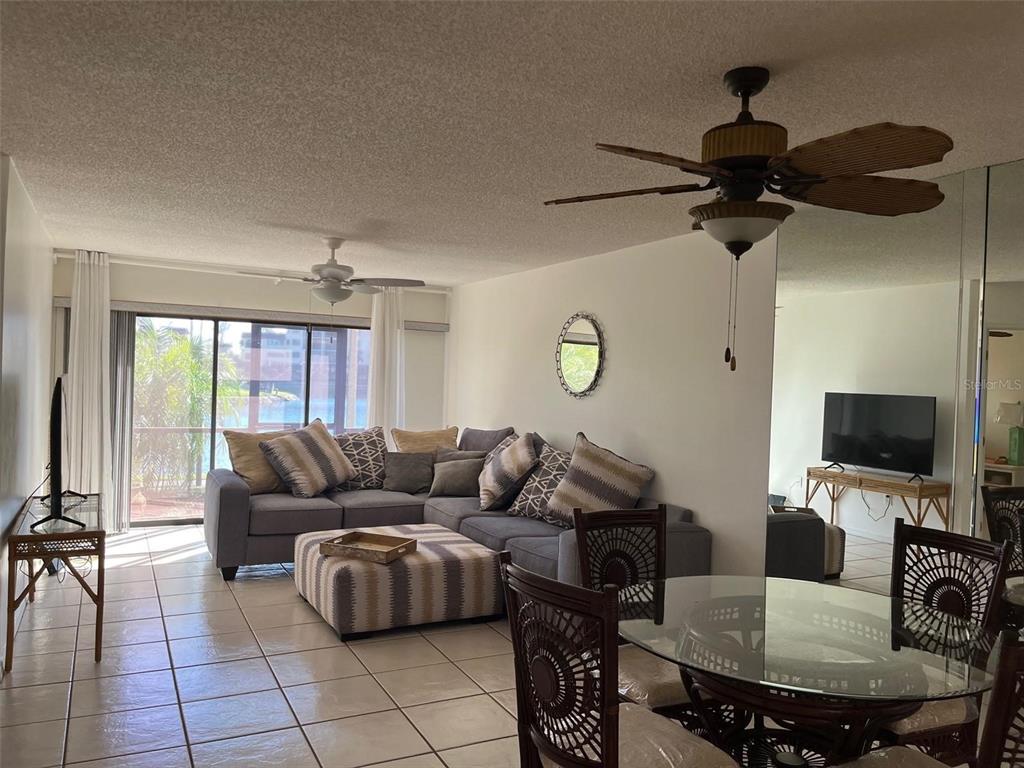 23465 Harbor View Road, Unit 1006 Punta Gorda, FL 33980 - Photo 7 of 41 a living room with furniture and a flat screen tv