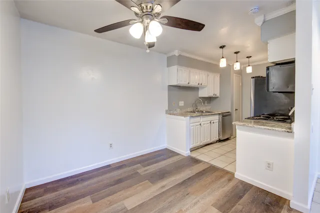 a kitchen with a sink cabinets and window