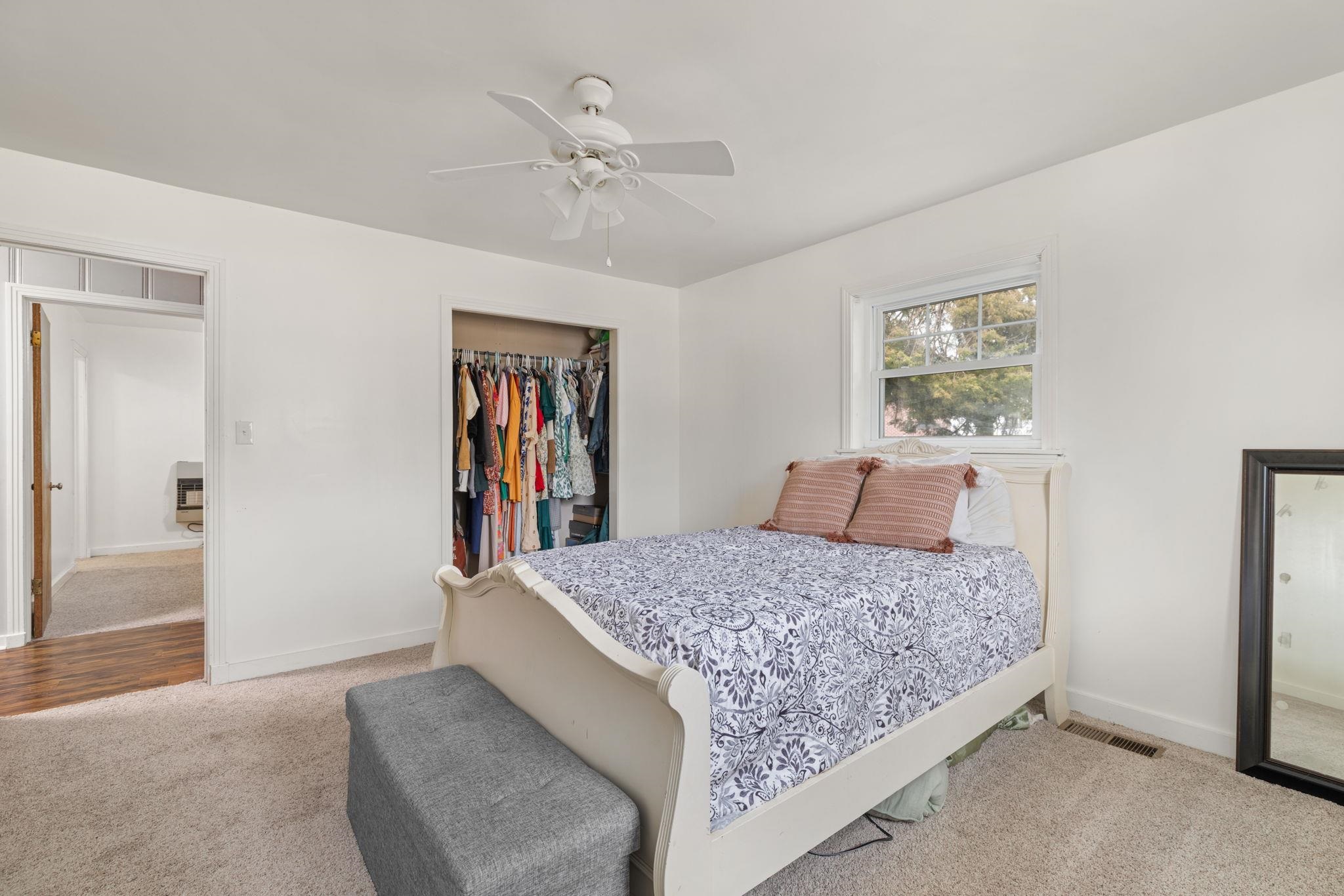 12 County Road 512 Corinth, MS 38834 - Photo 20 of 39 Bedroom featuring light carpet, a ceiling fan, a closet, and heating unit