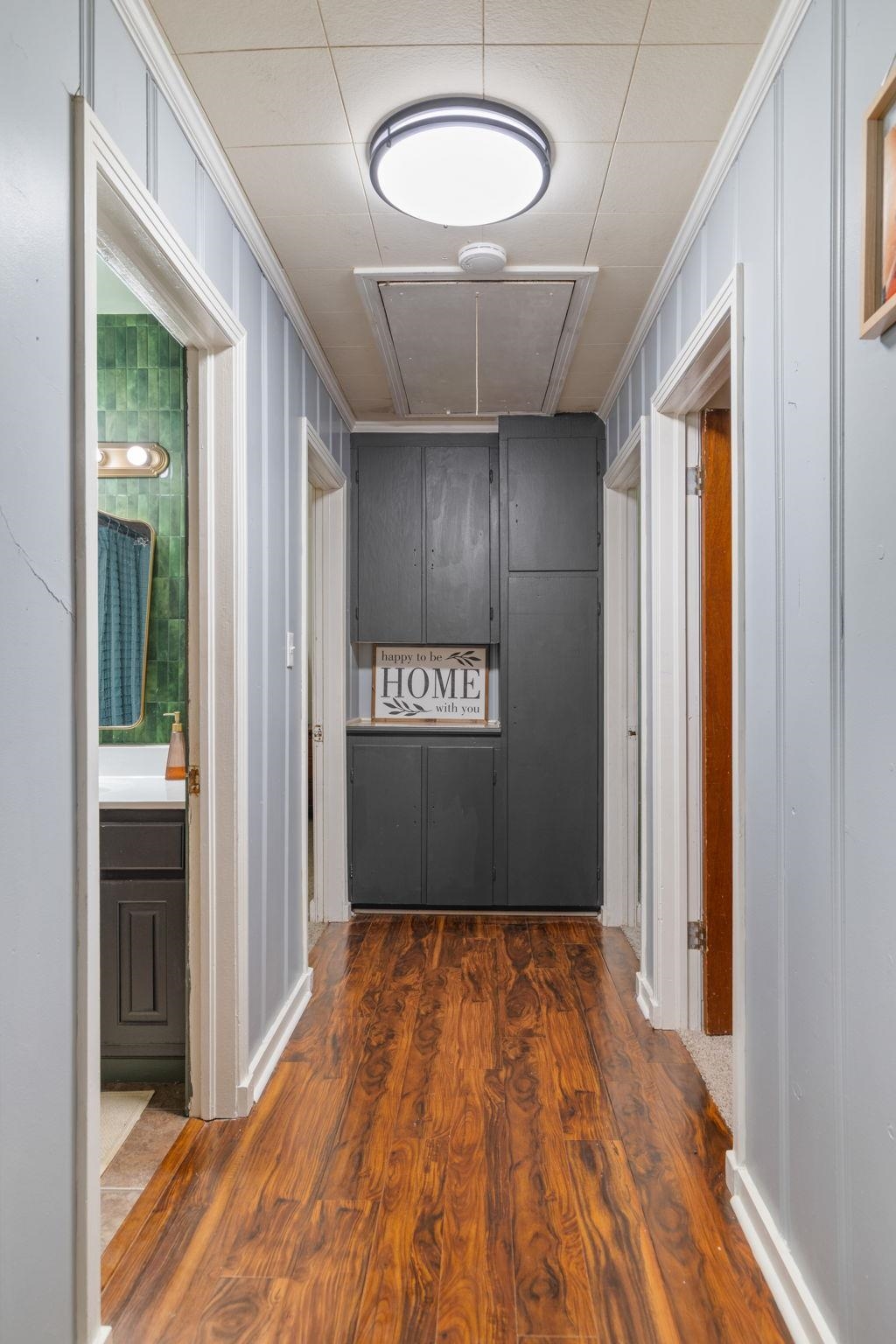 12 County Road 512 Corinth, MS 38834 - Photo 21 of 39 Hallway with dark wood-style floors and ornamental molding