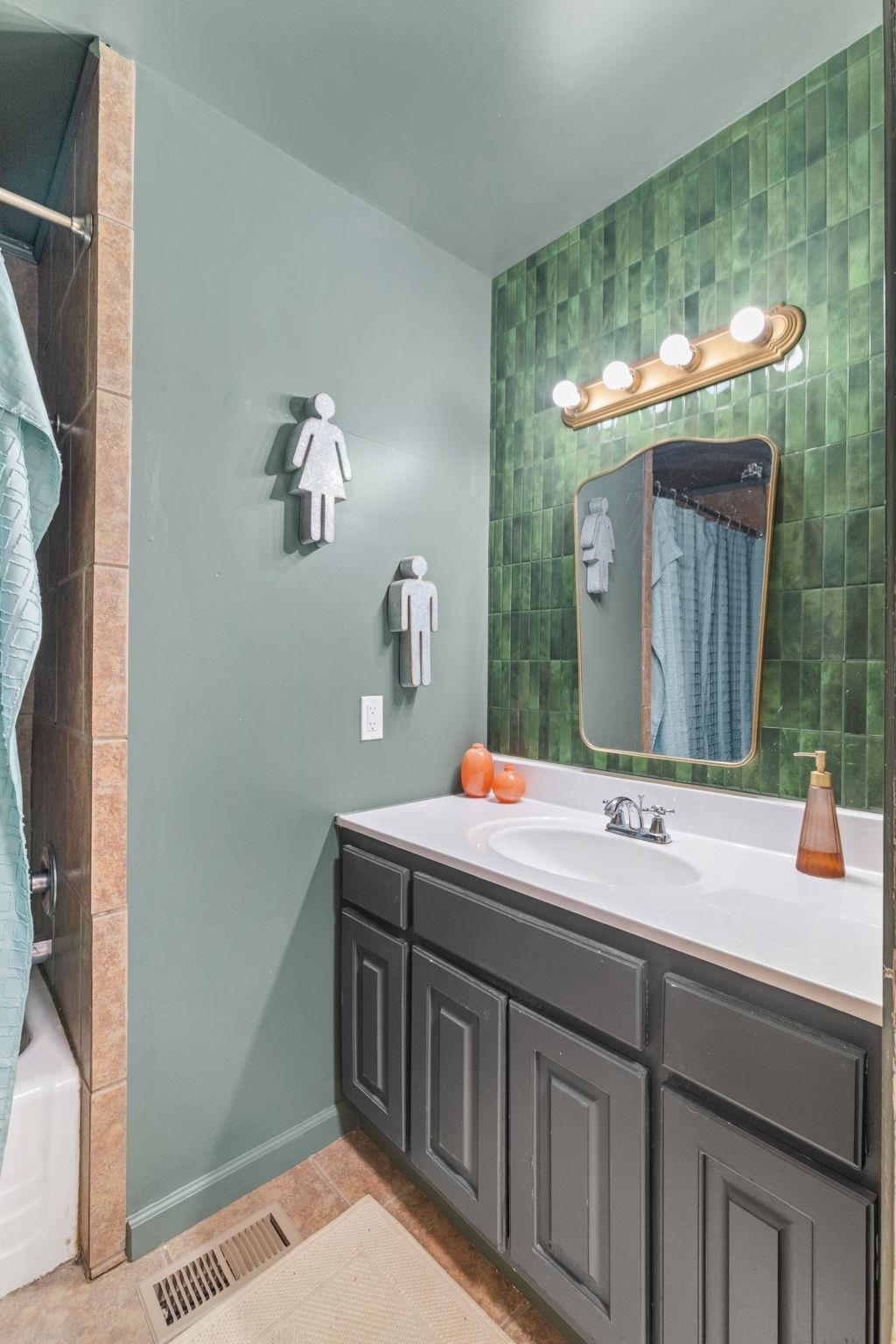 12 County Road 512 Corinth, MS 38834 - Photo 22 of 39 Bathroom featuring vanity, shower / tub combo with curtain, and light tile patterned flooring