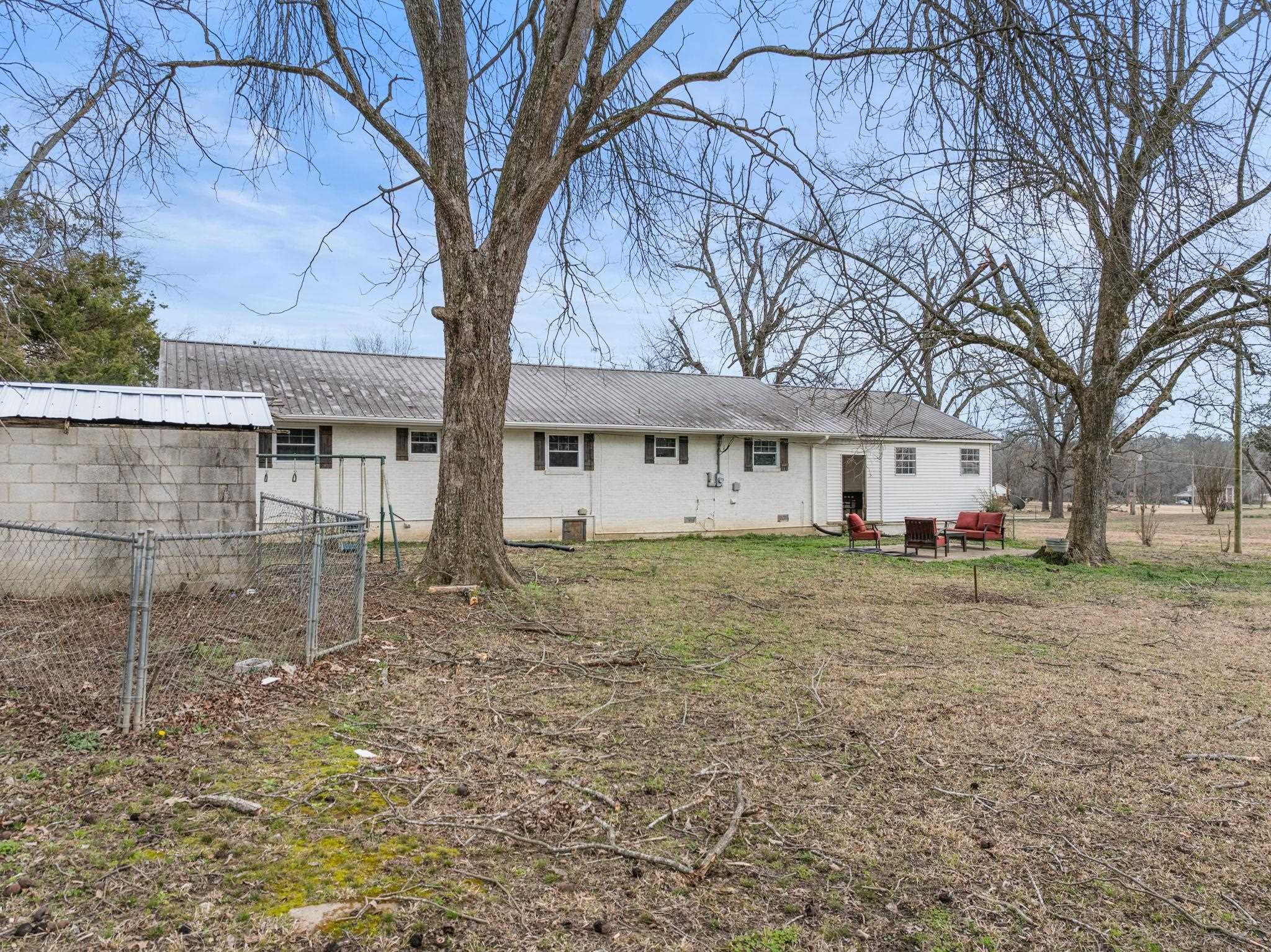 12 County Road 512 Corinth, MS 38834 - Photo 25 of 39 a view of a yard with a house and a large tree