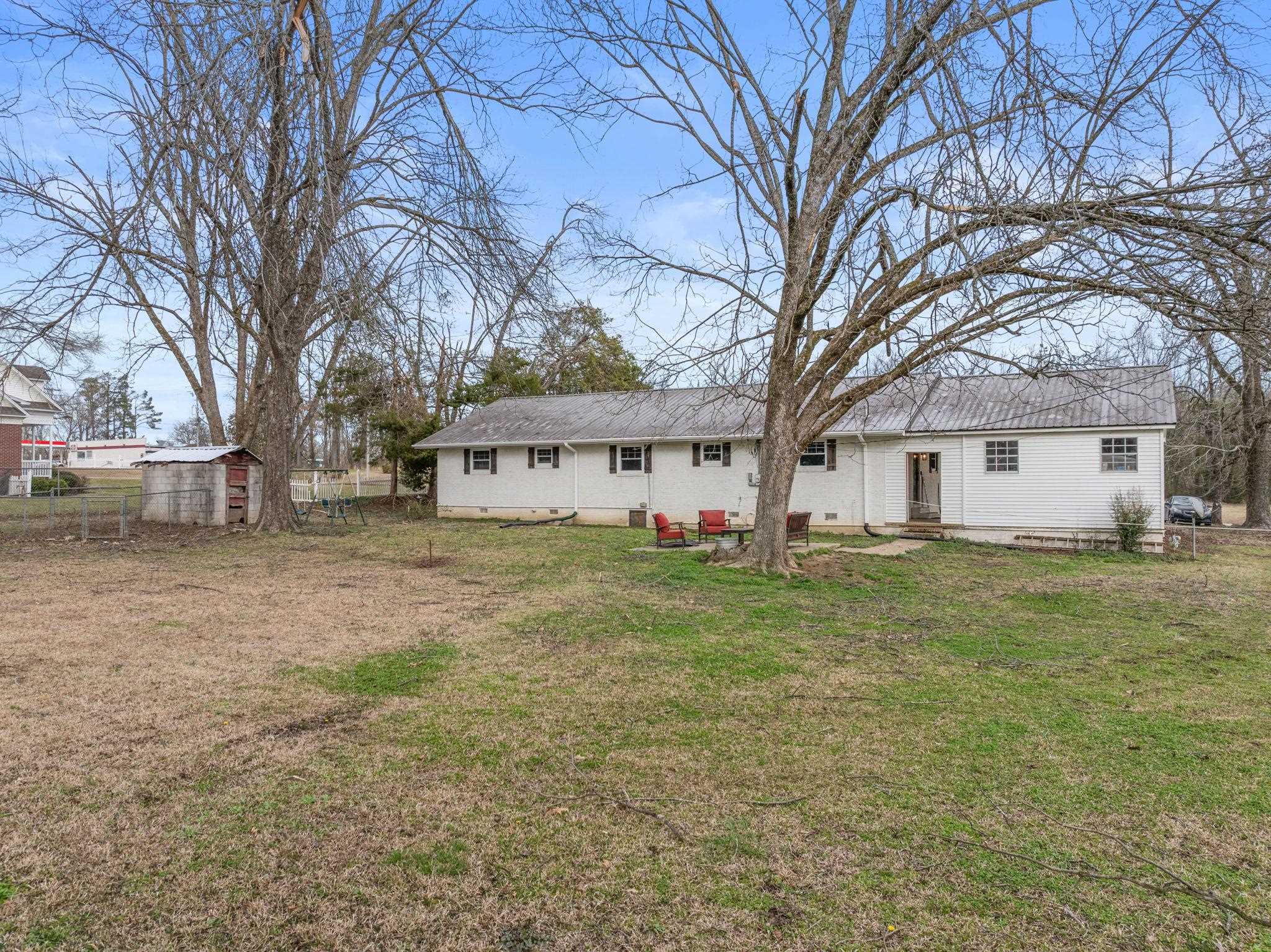 12 County Road 512 Corinth, MS 38834 - Photo 26 of 39 Rear view of house with crawl space and a shed