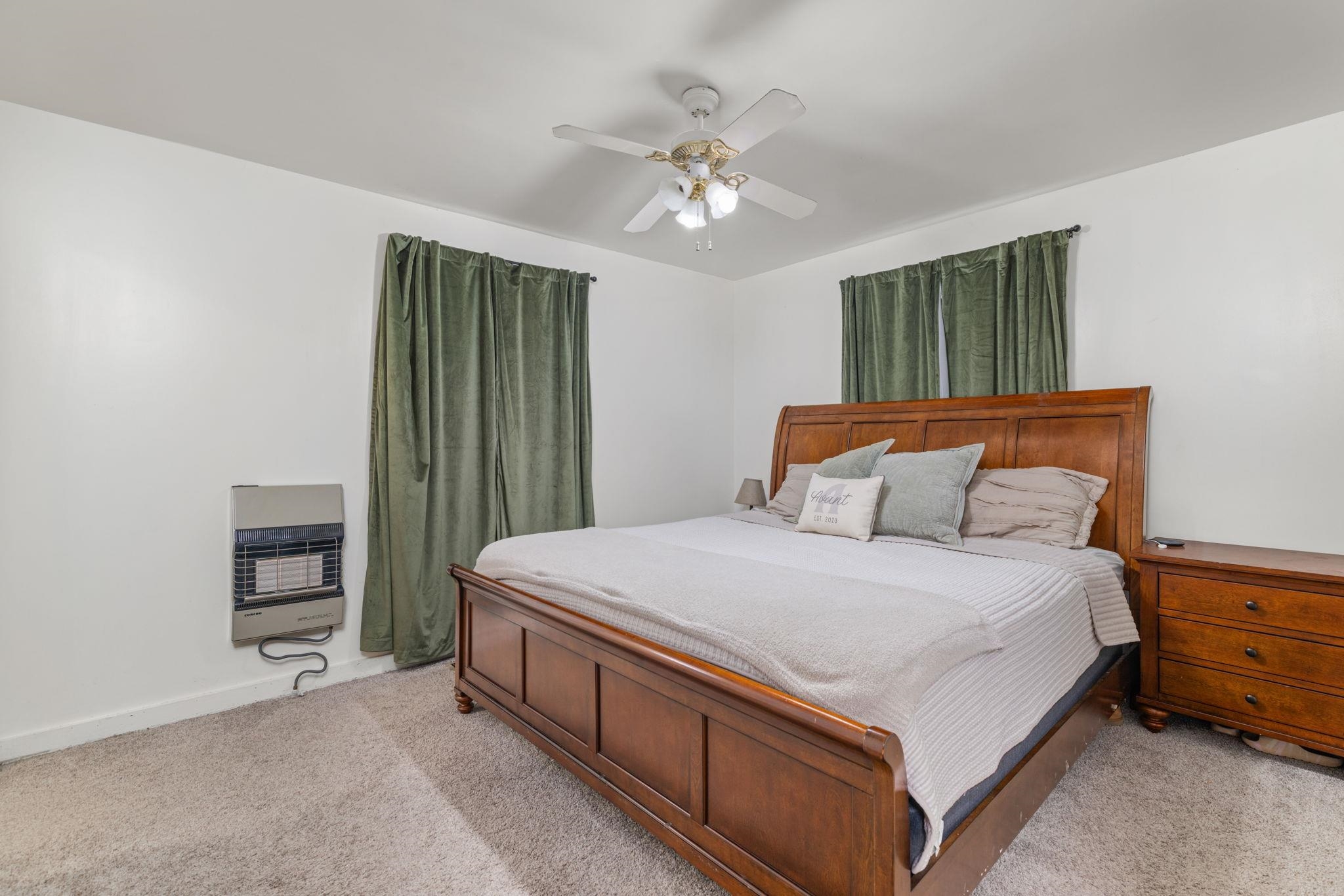 12 County Road 512 Corinth, MS 38834 - Photo 31 of 39 Carpeted bedroom featuring heating unit and ceiling fan