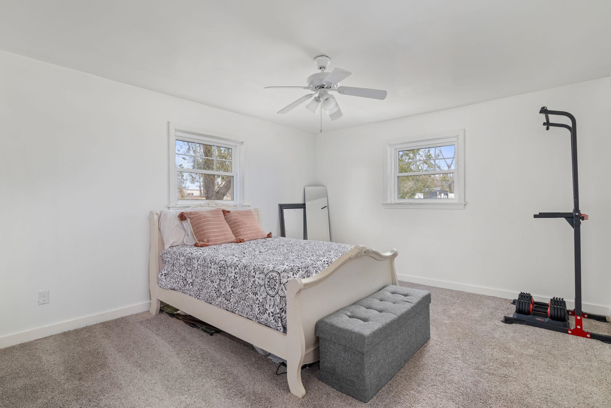 12 County Road 512 Corinth, MS 38834 - Photo 9 of 39 a bedroom with a bed and a lamp on the dresser