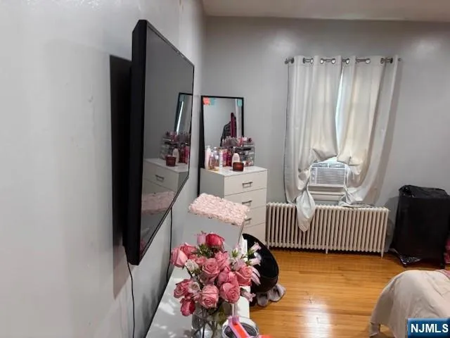 a bedroom with furniture and a rug