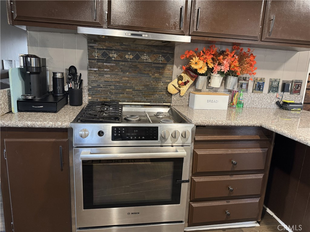 1025 South Riverside Avenue, Unit 66 Rialto, CA 92376 - Photo 11 of 53 a stove top oven sitting inside of a kitchen