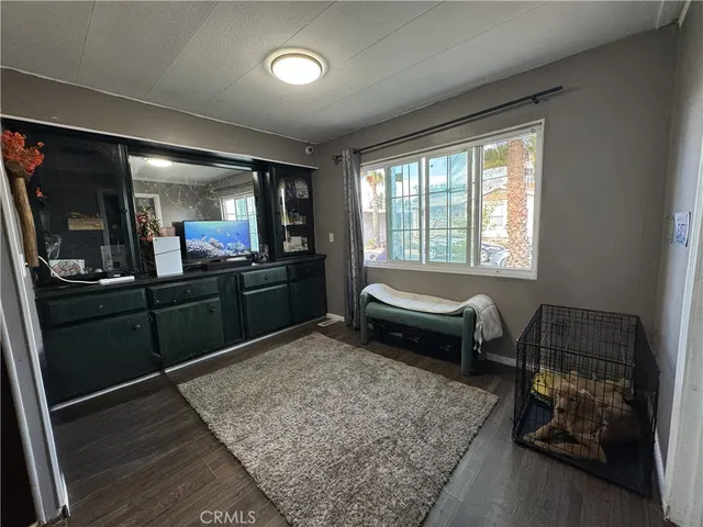 a living room with furniture and a rug