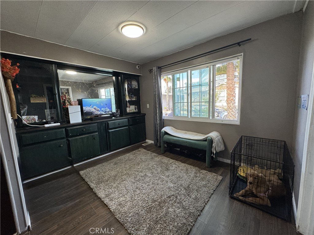 1025 South Riverside Avenue, Unit 66 Rialto, CA 92376 - Photo 15 of 53 a living room with furniture and a rug