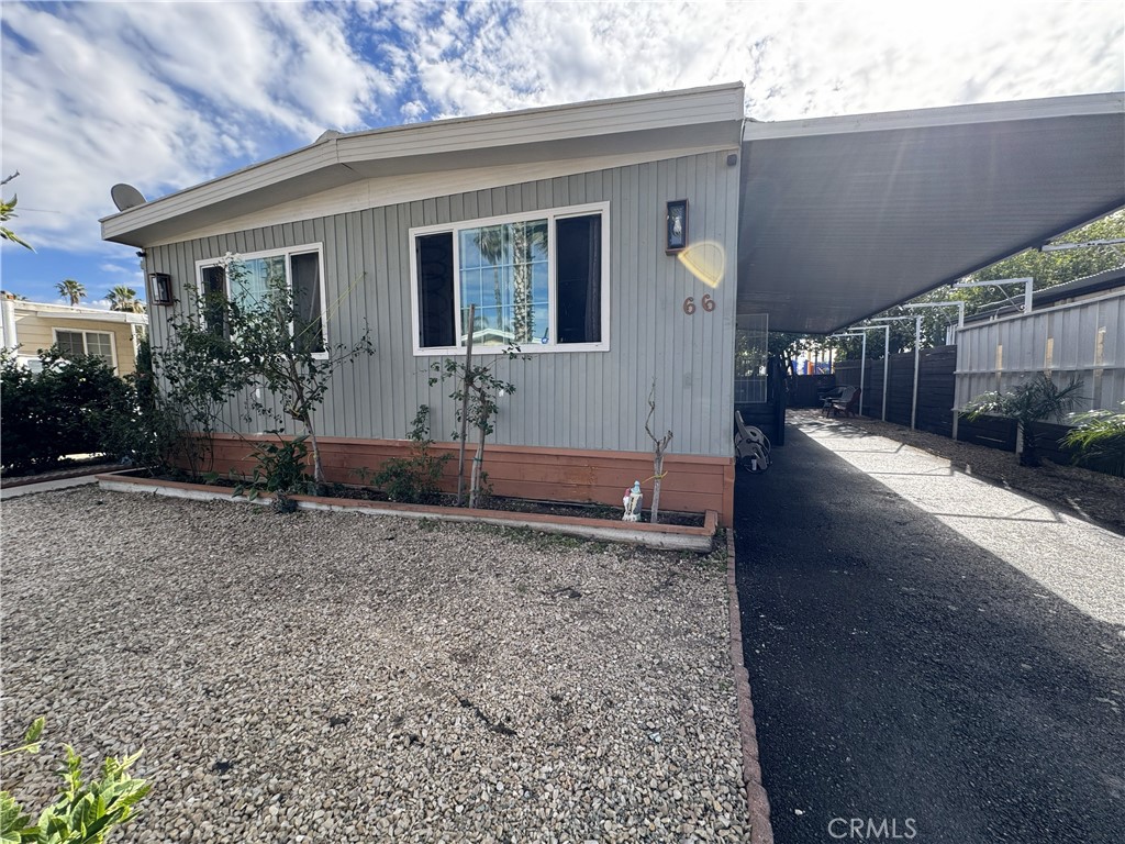 1025 South Riverside Avenue, Unit 66 Rialto, CA 92376 - Photo 2 of 53 a view of a house with backyard and garden