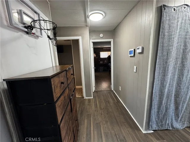 a view of hallway with wooden floor