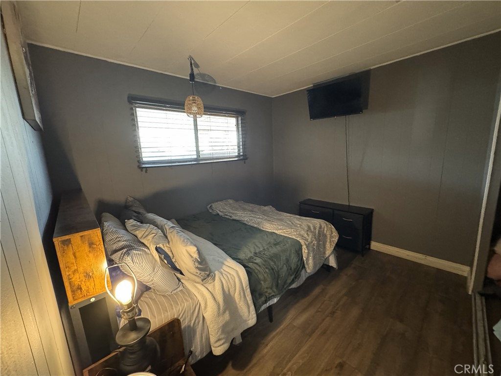 1025 South Riverside Avenue, Unit 66 Rialto, CA 92376 - Photo 26 of 53 a bedroom with a bed and a window