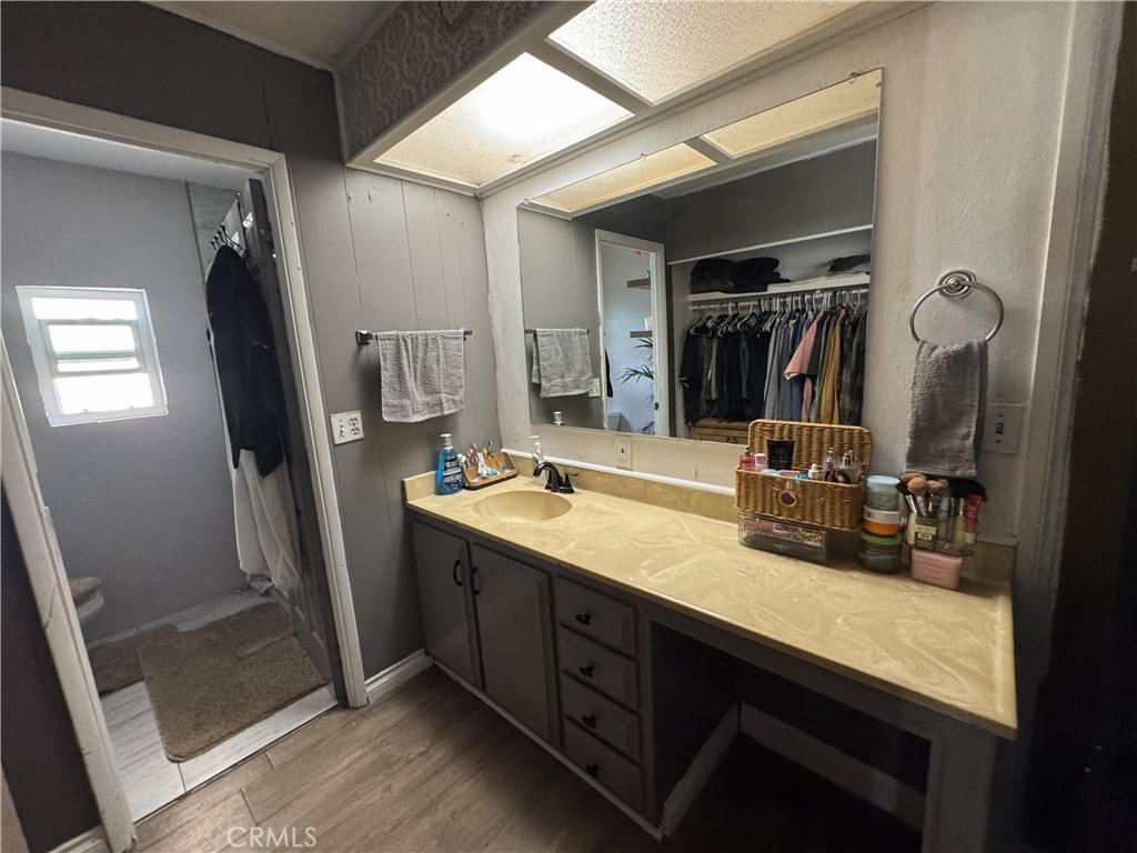1025 South Riverside Avenue, Unit 66 Rialto, CA 92376 - Photo 30 of 53 a bathroom with double vanity sink and a mirror