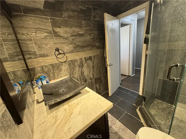 a bathroom with a sink and toilet