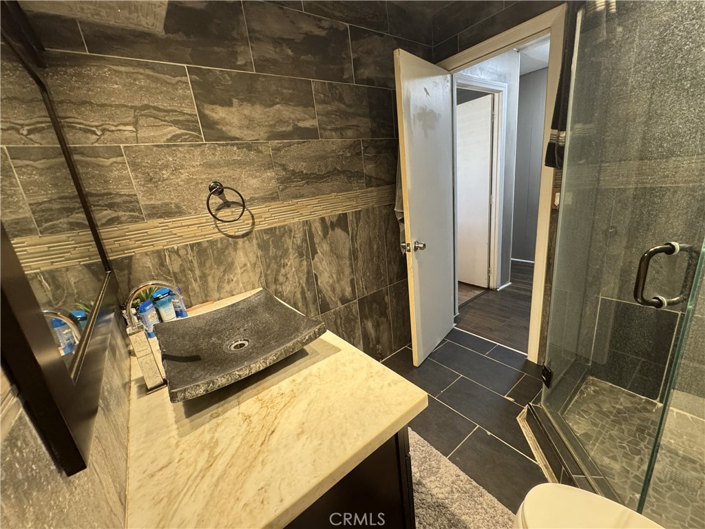 1025 South Riverside Avenue, Unit 66 Rialto, CA 92376 - Photo 33 of 53 a bathroom with a sink and toilet