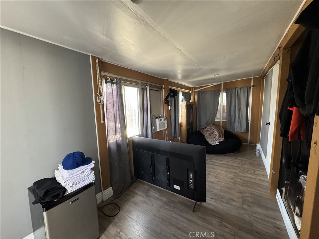 1025 South Riverside Avenue, Unit 66 Rialto, CA 92376 - Photo 35 of 53 a living room with furniture and a flat screen tv